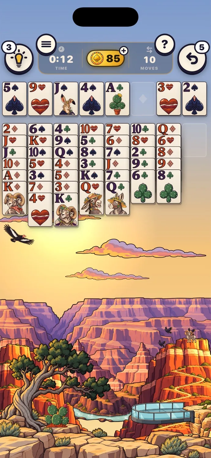 A game of FreeCell on the Grand Canyon table, with the canyon at golden hour and ravens below.